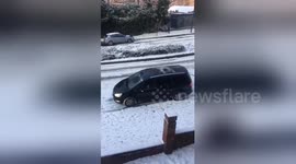 'Addison Lee taxi' slides downhill in London snow