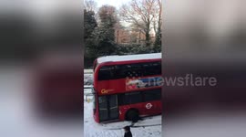 London bus grinds to a halt in snow