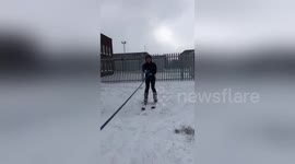 Man skis through snow-filled street after massive storm in Dublin