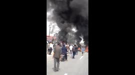 Demonstrators blocked the road by burning used tires in the middle of the road