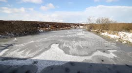 River freezes over during winter blast in Northern Ireland