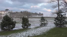 4K - Man in shorts walks dogs as The Beast From The East hits Devon