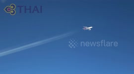 Air to air close up of rainbow colored contrails (chemtrails)