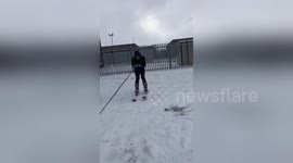 Newsflare Edit - Man skis through snow-filled street after massive storm in Dublin