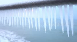 Huge icicles hang from railings on Cornish promenade
