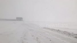 Snow turns closed Glasgow Airport into barren wasteland