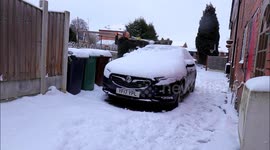 Cleaning Off Heavy Snow Covered Car