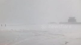 Snow turns closed Glasgow Airport into barren wasteland