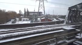 Snow covers the rail tracks as train is approaching Peterborough station