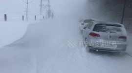 Giant snow drifts bring Greater Manchester roads to a standstill