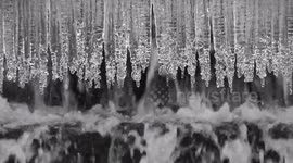 Icicles with water flowing below in Cornwall