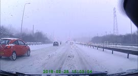 Man rides motorbike around snow covered Edinburgh bypass