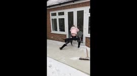 Woman slips on ice trying to open back door