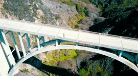 balancing at deathly heights on a scenic bridge