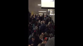 Pushy man gets escorted to the back of the Tube queue as crowd cheers
