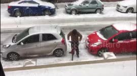 Funny moment man attempts to ride bike on icy UK road