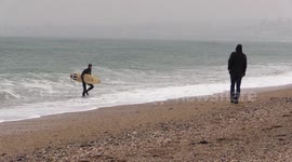 Surfers take advantage of swell from Storm Emma