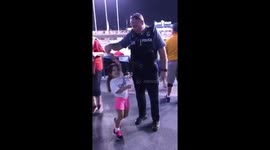 Kansas City Missouri Police Officer Brent Wright dances with little girl