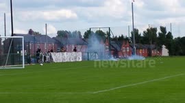Romanian fans throw fireworks onto football pitch