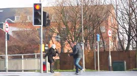 Good Samaritan helps pedestrian cross the road 'in gale force winds'