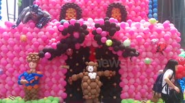 Man blows balloons with nose