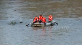 body of a horse out of the Somes River by fireman in Romania