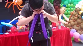 Man inflates balloons with nose