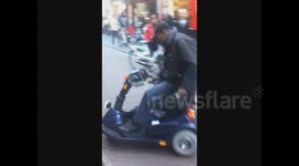 Man does amazing wheelchair wheelies in Amsterdam