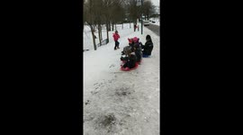 UK policeman challenges children to sledging race