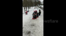 UK policeman challenges children to sledging race
