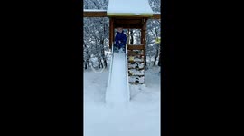 Snow slide! 5 year old goes down a slide filled with snow *slow mo*