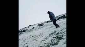 Guy faceplants while sledging