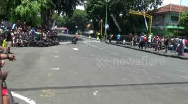 smooth circuit arena, resulting in motor racing participants falling