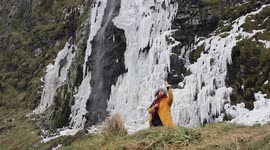 Women Taking Selfie In Front Of Frozen Waterfall