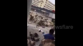 Strong wind blows books away in Chinese college