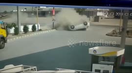 Two men crawl out from speeding car after it flips over