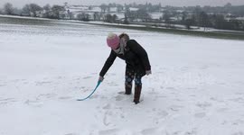 Dog searches for Snowball - in the snow!