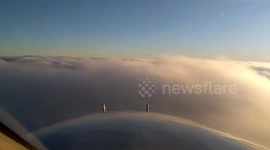 Plane “floats” on clouds