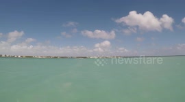 Time-lapse boat ride into port from sea