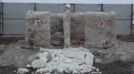 Public toilet made of snow and ice built for winter fishing season