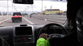 In an Indonesian police car while on a highway patrol