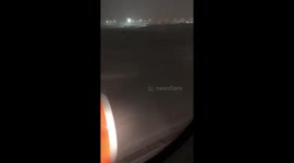 Luton Airport flight from Geneva landing in heavy snow.
