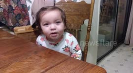 Hilarious moment when baby girl realizes dad is filming