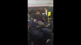 Platform 15 on Clapham Junction chaos following wrong announcement. Overcrowding, un-coordinated, systems down etc from Southern Rail. In UK