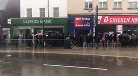 Polite Londoners QUEUE to avoid flood on high street