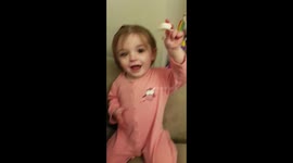Angelic toddler does magic trick with pacifier