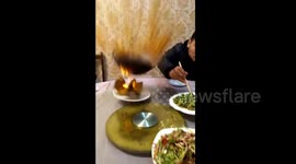 Cooking pot explodes in front of startled diners