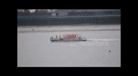 London Fire Brigade fireboat Fire Dart undertaking 'Person in water' recovery training on the River Thames in London