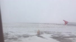 Airplane taking off with very low visibility due to fog