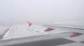 Airplane taking off with really low visibility due to fog (2)